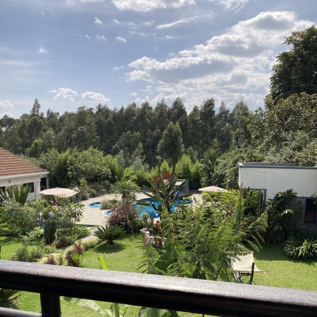 Looking out over the courtyard of Rwanda's Five Volcanoes Hotel from the restaurant balcony