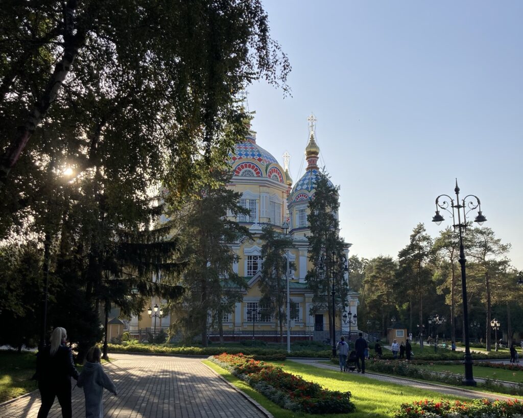 Colourful Ascension Cathedral peeks out from behind the trees in Almaty's Panfilov Park