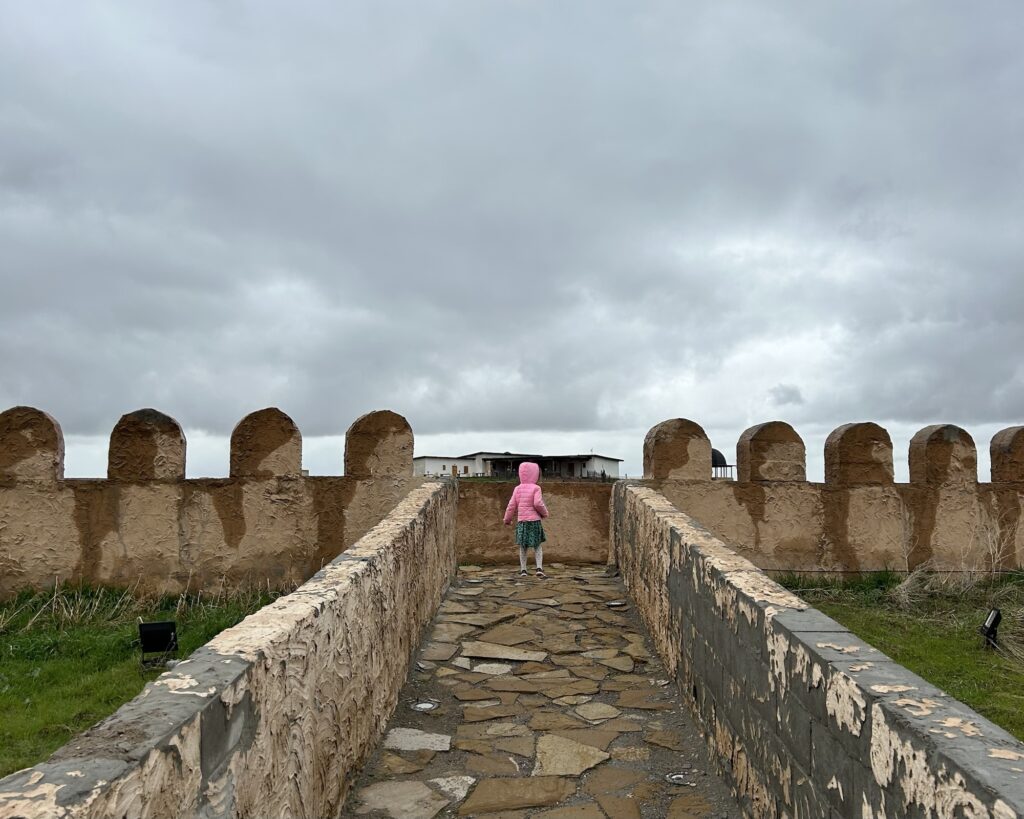 a photo of a girl at the top of a fortress in Shymkent in Kazakhstan