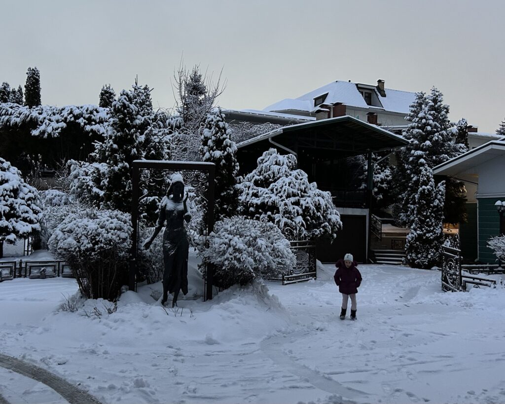 A photo of a snowy yard in a residential complex in Almaty Kazakhstan